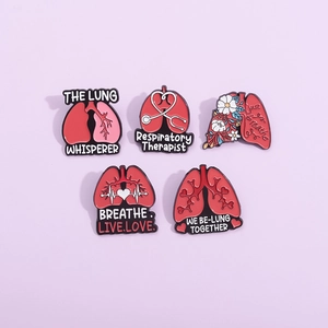 Set of five creative anatomical lung enamel pins with floral and heartbeat designs