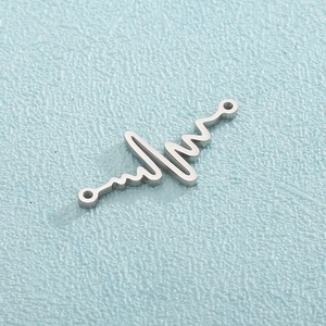 Detailed close-up of a silver heartbeat pulse charm with double loops for jewelry making