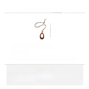 Detail showing 90cm vintage velvet rope necklace with amber resin bead and flocked pendant