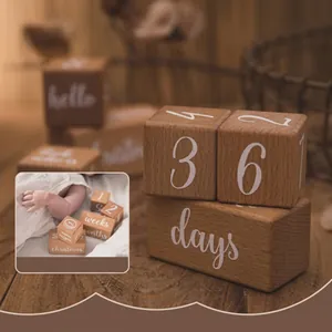 Macro shot of natural beechwood baby milestone blocks with smooth rounded corners