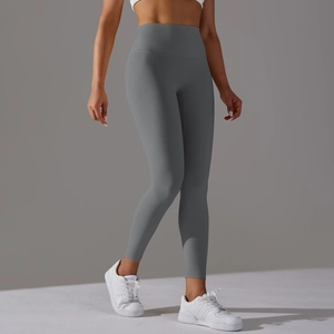 Detail of high-waist charcoal yoga pants showing elastic texture and body-sculpting fit