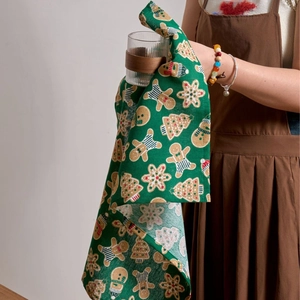 Christmas theme green cloth napkin with gingerbread man print for holiday table decor