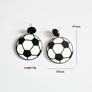 Detail showing dimension and weight of black and white acrylic soccer ball earrings