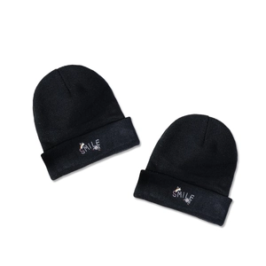 Set of two black knit beanies with colorful rainbow smile embroidery for warmth and style