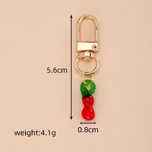 Detailed view of red glass gourd keychain with dimensions 5.6cm and weight of 4.1g