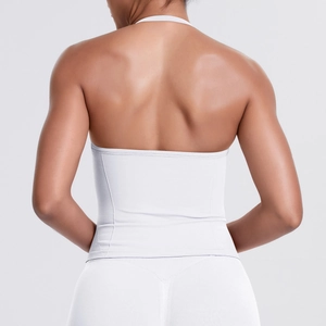 Detail of white seamless sports top featuring ribbed texture and open back design