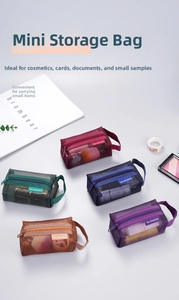 Flat lay of colorful nylon mesh organizers with zippers for cards and small cosmetics