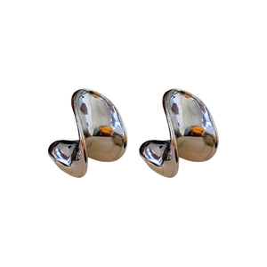 Chic silver C-shaped fluid metal stud earrings with a modern minimalist twisted design