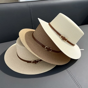 Flat top straw sun hats for women with leather straps in cream, brown and beige colors