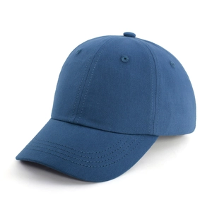Close-up of navy blue cotton baseball cap with classic six-panel structure and curved brim
