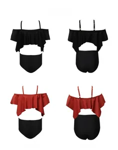 Detail view of girls' two-piece bikini featuring ruffled straps and high-waist swim bottoms