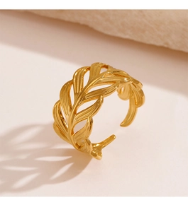 Detailed close-up of golden hollow leaf ring with adjustable open band design