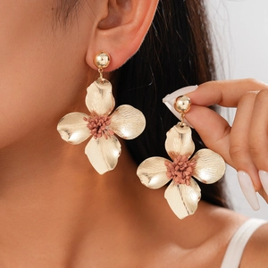Retro golden flower stud earrings with brushed metal texture and pink floral centers