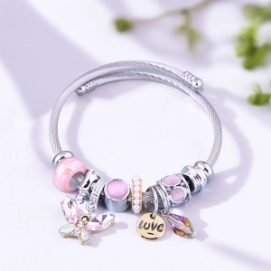 Detail of silver beaded bracelet with pink glass charms and a crystal butterfly pendant