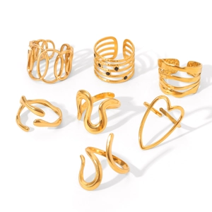 Set of 7 gold plated stainless steel rings featuring geometric and open designs