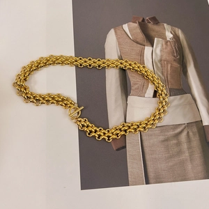 Detail of 18k gold plated titanium steel chunky chain necklace with a T-bar toggle clasp