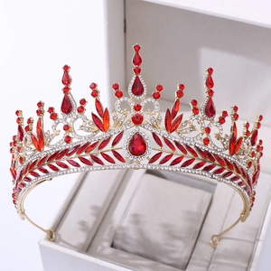Detailed macro view of luxurious golden bridal crown with red crystals and rhinestones