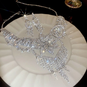 Close-up of sparkling floral rhinestone necklace set with elegant fringe tassel details