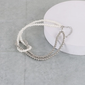 Detail of mixed faux pearl and silver bead necklace with adjustable lobster clasp