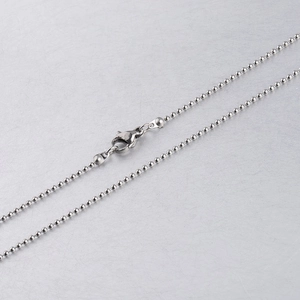 Detailed close-up of a silver stainless steel ball chain with a secure lobster clasp