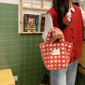 Detail of red and white checkered lamb wool tote bag with LOVE SOZAKKA woven label