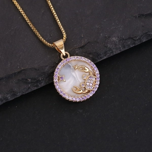 Macro shot of 18K gold Scorpio necklace with purple stones and white shell inlay