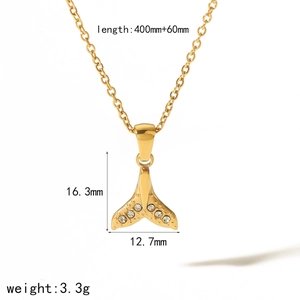 Golden stainless steel necklace featuring a fish tail pendant with clear gemstones