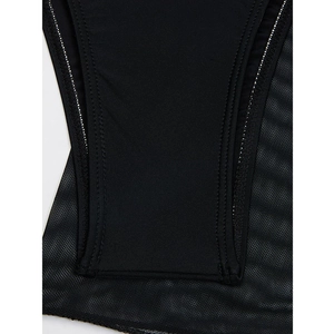 Detailed macro view of black mesh stitching and matte fabric on woman swimwear