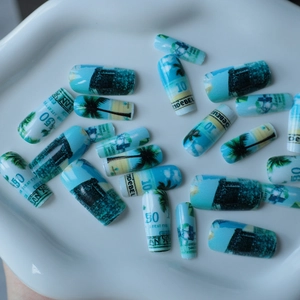 Tropical beach style long fake nails with palm tree pattern on white porcelain plate