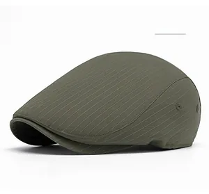 Detail of military green striped beret hat with metal eyelets and structured vintage design