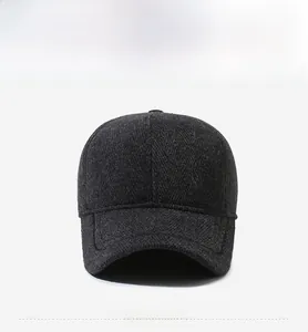 Detail of wool blend winter cap with thick texture and metallic SPORTS emblem on the side