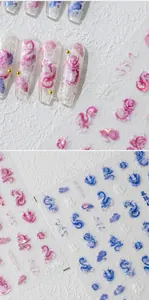 Macro shot of 5D dragon nail stickers with 3D embossed texture and laser pearl finish