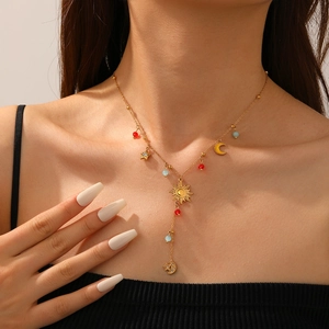Gold plated stainless steel Y-necklace with sun, moon, star charms and colorful beads