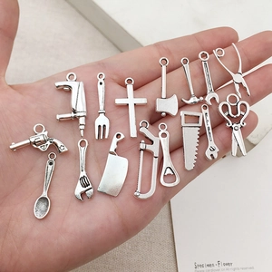 Assorted vintage silver alloy charms for DIY bracelets and necklaces featuring tool shapes