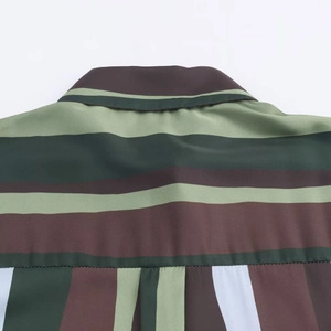 Detailed close-up of the striped satin shirt back collar with high quality fabric texture