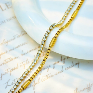 Double-layered gold chain necklace with white cubic zirconia and cylinder pendant