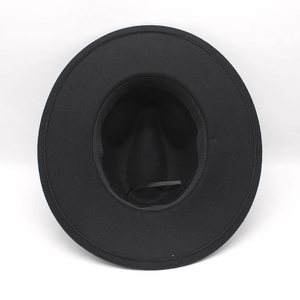 Detail view of the interior black wool felt hat with adjustable size ribbon strap