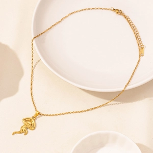 Close-up of golden jellyfish pendant with O-chain and adjustable lobster clasp