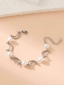 Macro detail of silver moon and pearl bracelet with high-quality metal finish and clasp