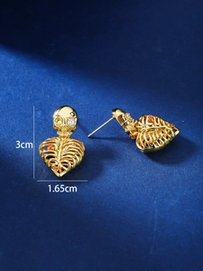 Detail view of gothic gold skeleton heart earrings with rhinestones and size dimensions