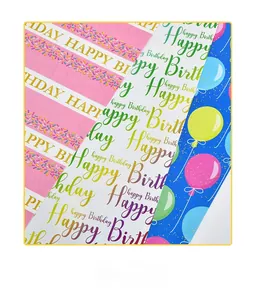 Detailed close-up of three colorful Happy Birthday gift wrapping paper designs