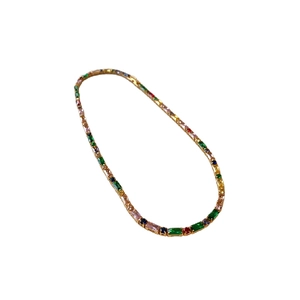 Gold-plated necklace with colorful round zircon stones on a white background