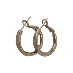 Minimalist silver twist hoop earrings with a polished metallic finish on a white background
