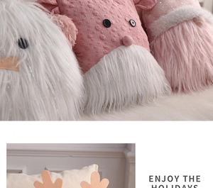 Detail of plush Christmas pillows with knit textures, reindeer antlers and holiday vibe