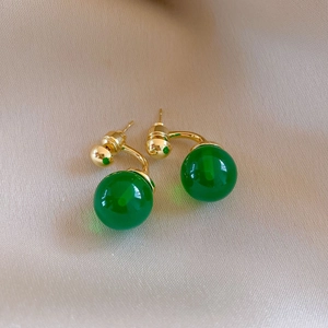 Detail view of ethnic style dark green agate bead drop earrings with gold metallic finish