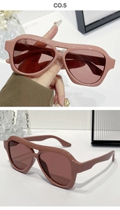 Detail view of retro oversized pink pilot sunglasses with thick frames and double bridge