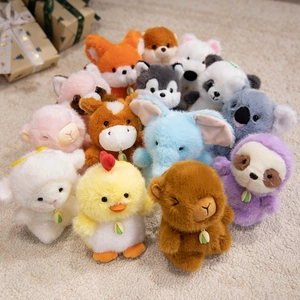 Assorted cute plush animal keychains including panda and elephant on soft carpet