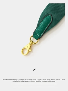 Detail of 5cm wide green woven shoulder strap with leather ends and gold lobster clasp