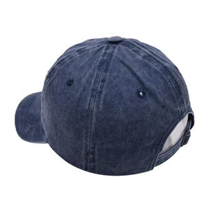 Detail of adjustable metal buckle and stitching on a vintage navy washed cotton baseball cap
