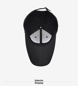 Interior view of the black cotton baseball cap showing 6-panel structure and white lining